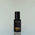 A bottle of Bold Fortune Eau de Parfum against a grey background.