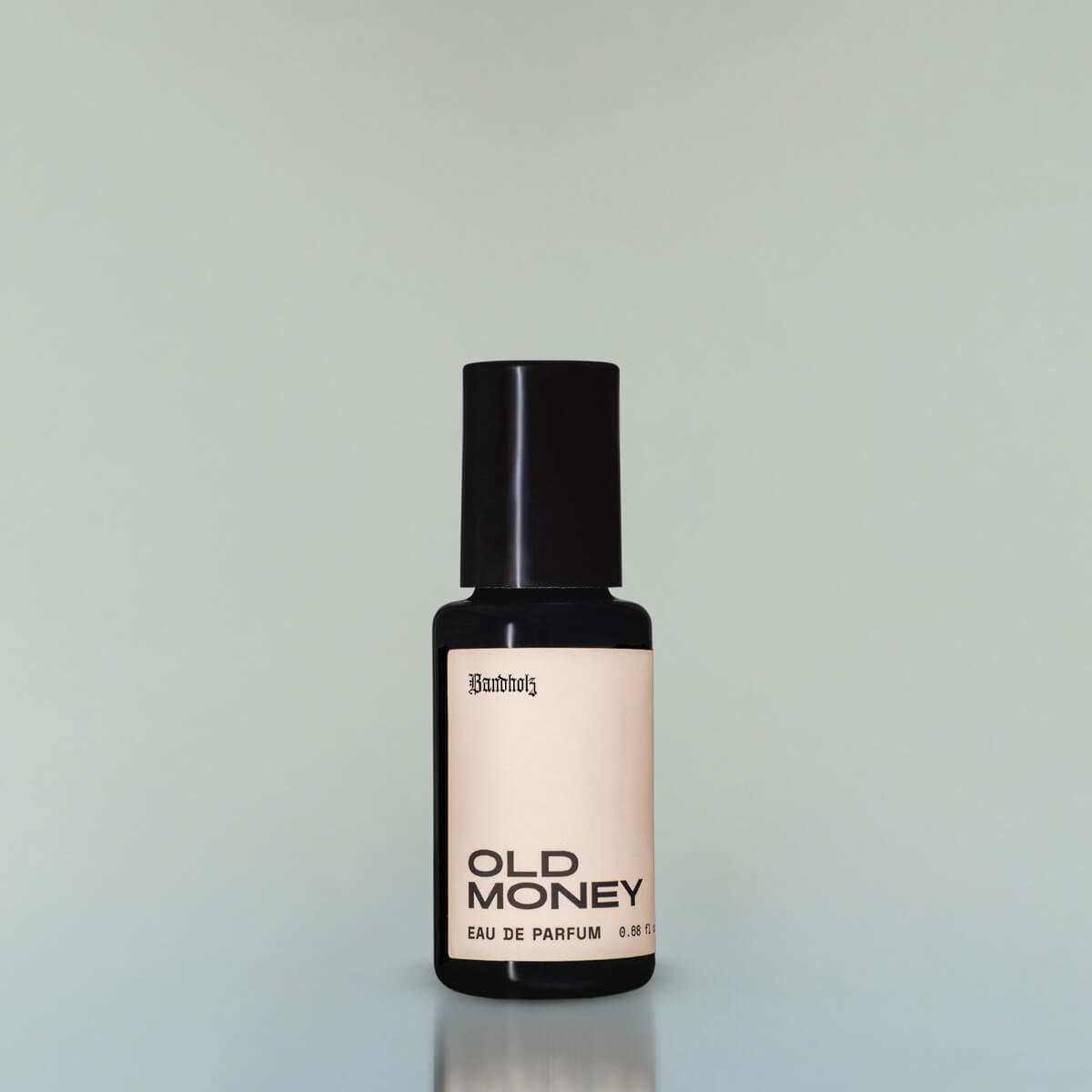 A bottle of Old Money Eau de Parfum against a grey background.