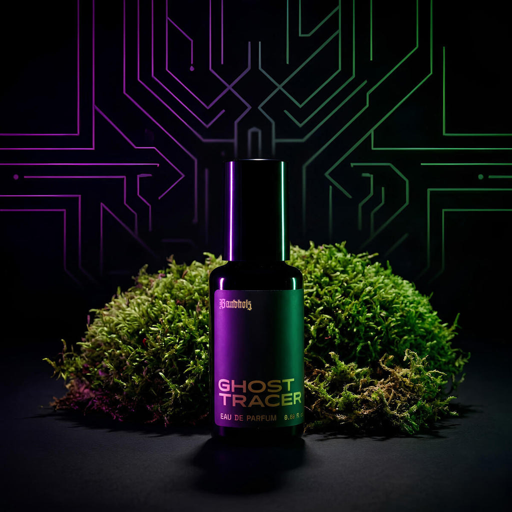 Ghost Tracer Eau de Parfum bottle by Bandholz placed in front of vibrant green moss with a neon circuit-style background. Image reflects a futuristic, earthy fragrance with notes of rain, moss, ozone, and violet leaf.